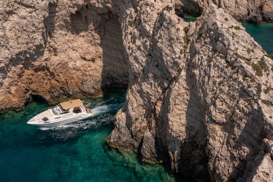 Sailing past the famous Shipwreck Beach on a luxury yacht.